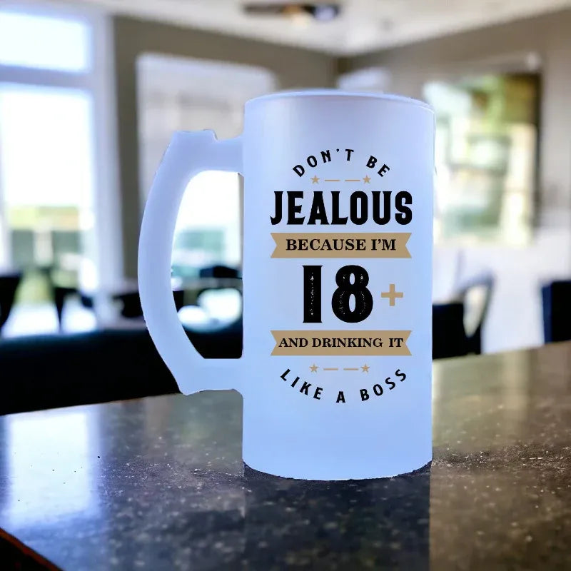 Frosted mug with humorous text design on a table.