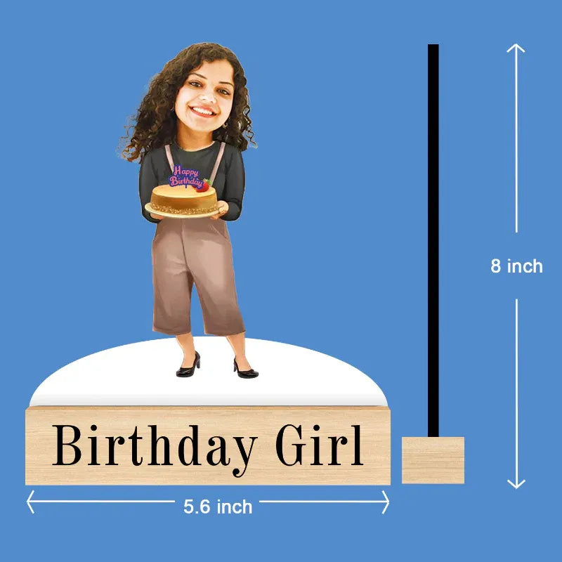 Figurine of a girl holding a cake with dimensions labeled on a blue background
