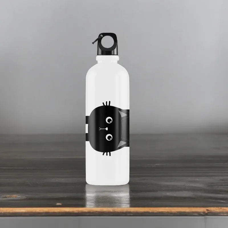 White water bottle with black cat design on a wooden surface