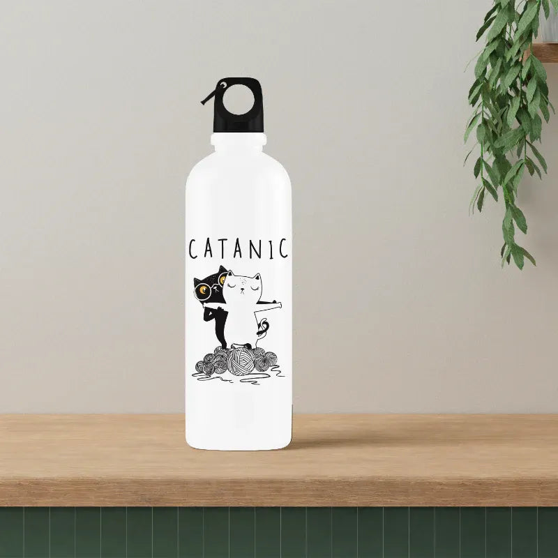 White water bottle with black cat design and 'CATANIC' text on a wooden surface.