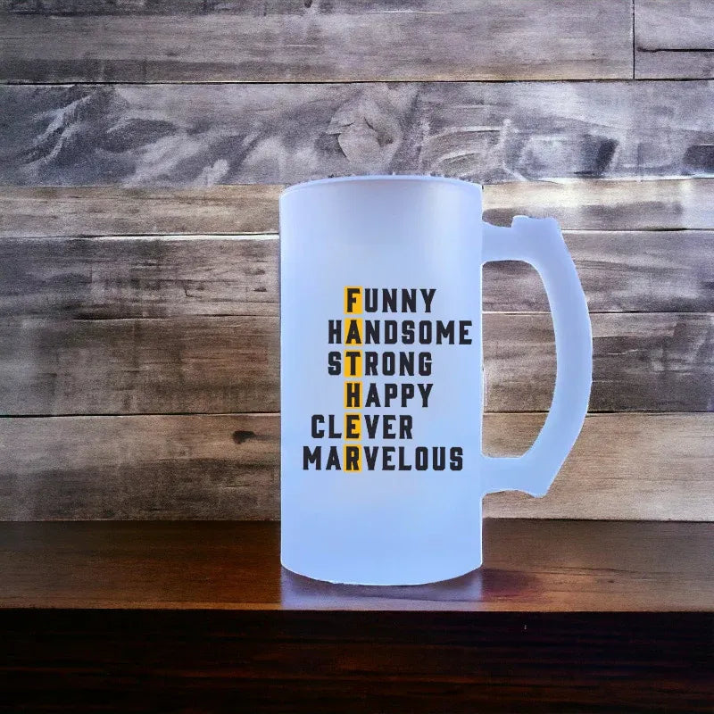 Frosted glass mug with motivational text on a wooden surface