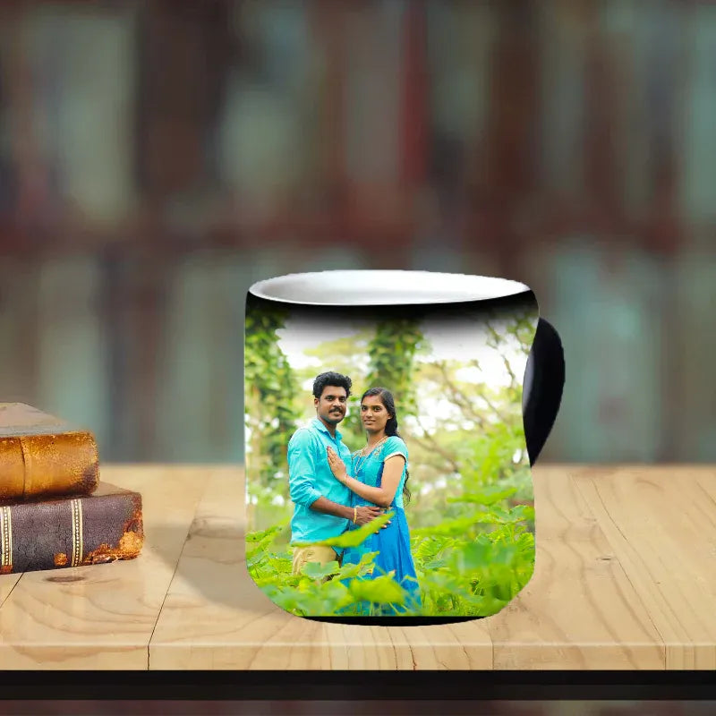 Mug with a printed photo of a couple on a wooden surface