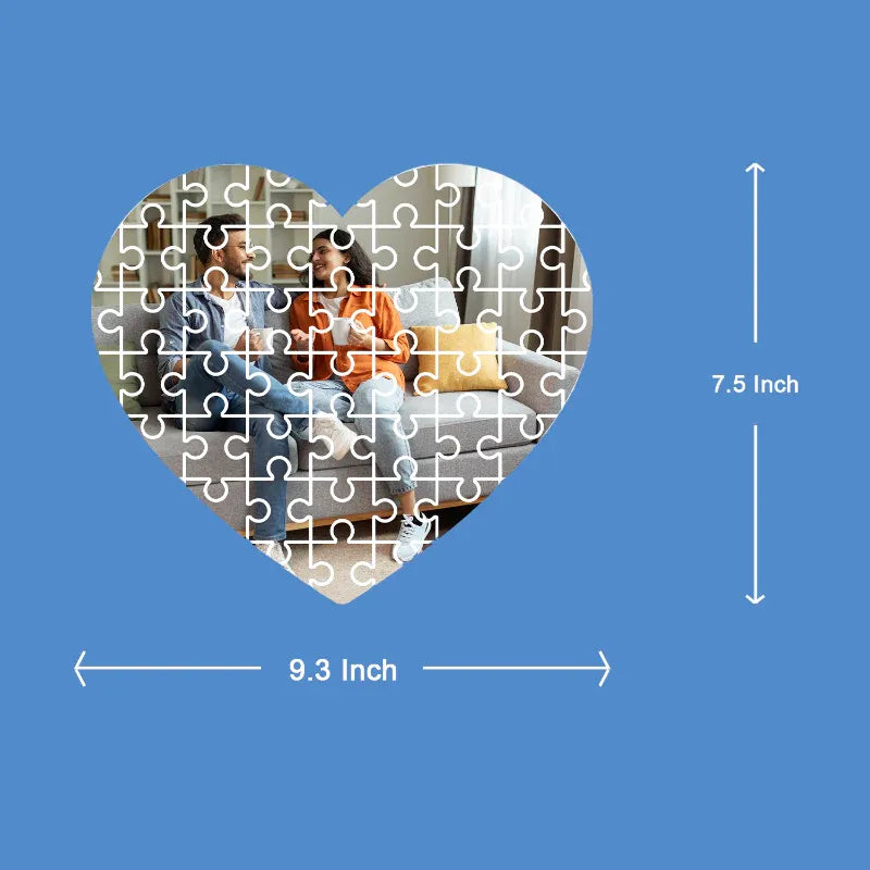 Heart-shaped puzzle with a couple on a couch, displayed against a blue background with measurements.