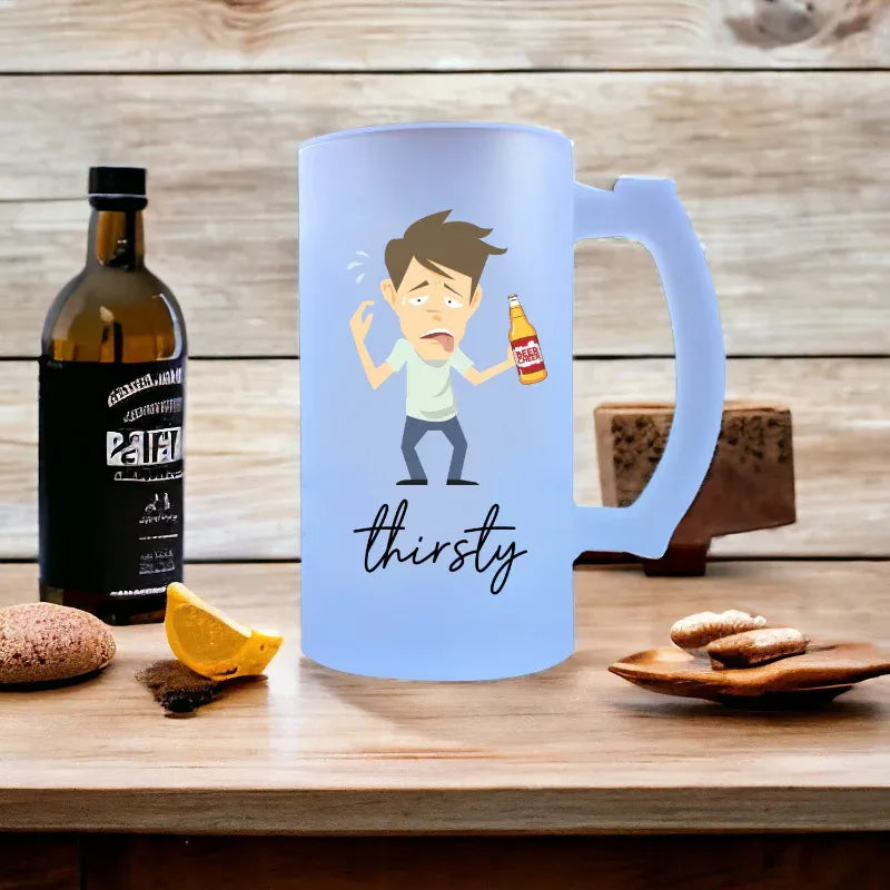 Light blue mug with cartoon character and 'thirsty' text, bottle of beer in the background