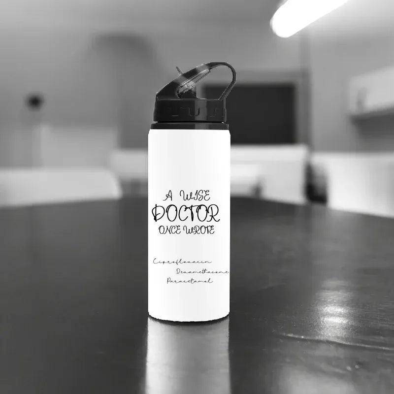 White water bottle with text on a dark surface