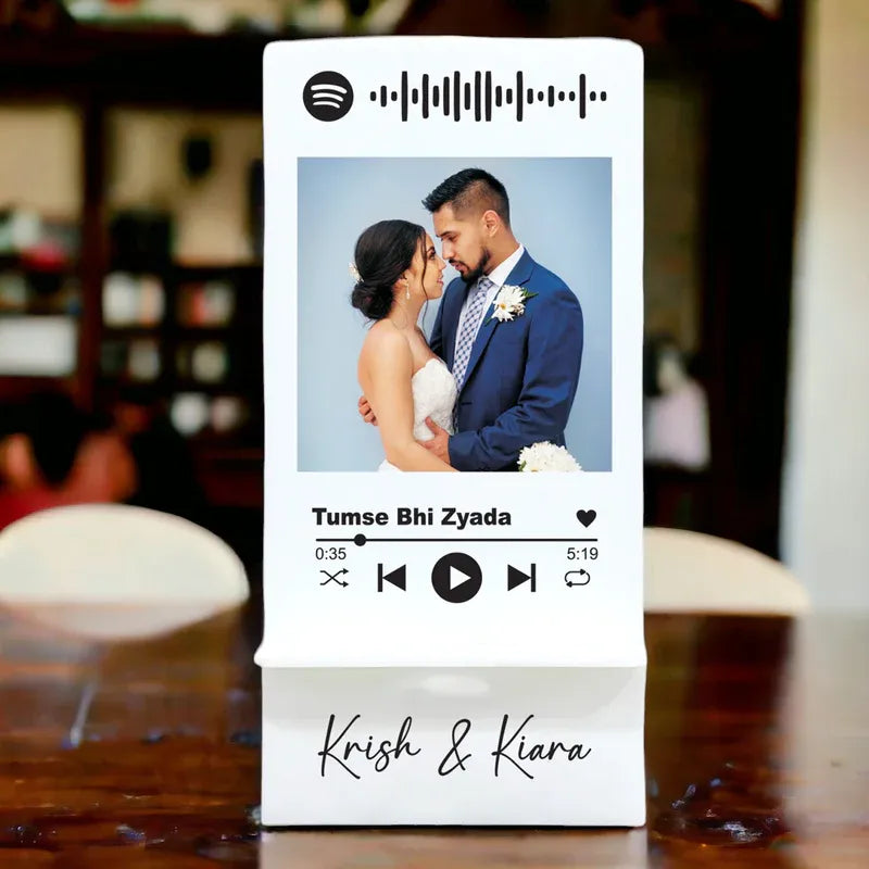 Spotify-inspired design with a couple's photo and personalized text on a blurred background