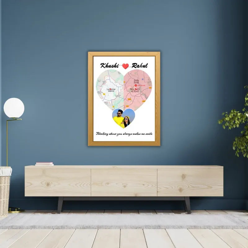 A personalized photo frame with a heart-shaped design, featuring a couple's photo, location maps, and a quote in Hindi script.
