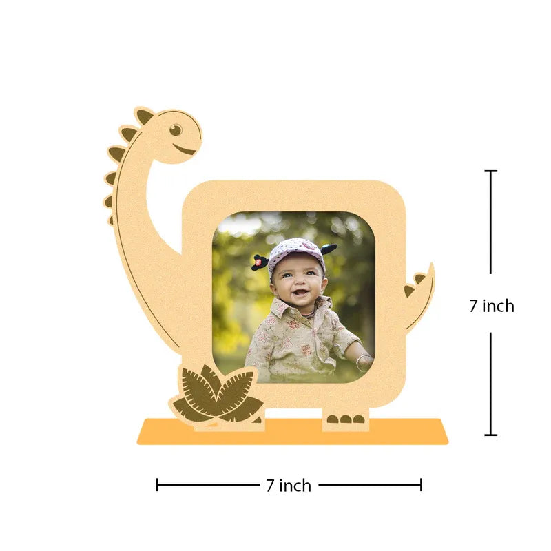Dinosaur-shaped photo frame with a child's picture inside, showing dimensions on a white background.