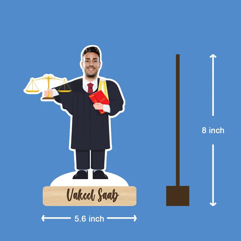 Figurine of a lawyer holding scales and a book, with dimensions on a blue background