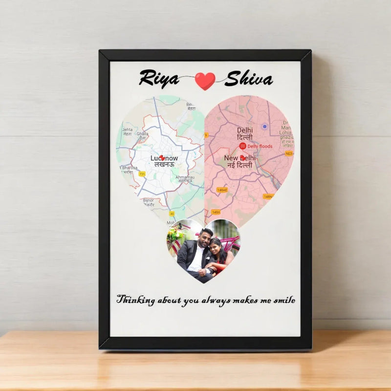 A personalized photo frame with a heart-shaped design, featuring a couple's photo, location maps, and a quote in Hindi script.