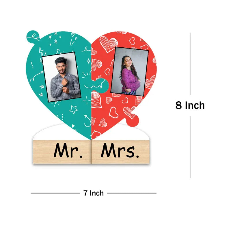 Heart-shaped photo frame with 'Mr.' and 'Mrs.' labels, displaying two people's photos on a white background.