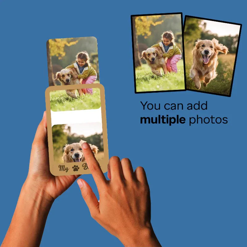 Hands holding a card with a dog photo, with additional photos of a dog and a child on a blue background.