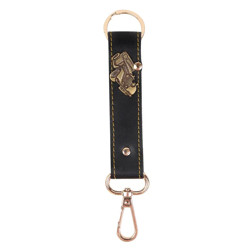 Black leather keychain with gold accent on a white background