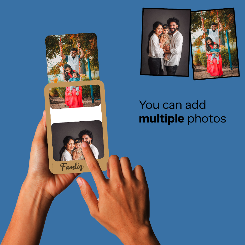 Hands holding a photo album with family photos on a blue background