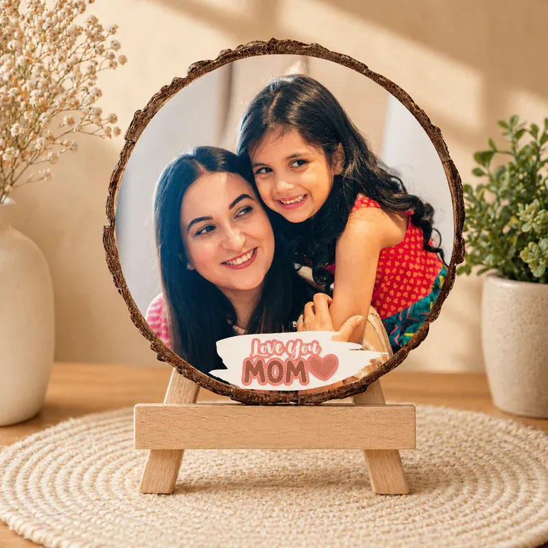 Personalized round photo frame for mom with Love You Mom print, natural wood bark edges and wooden easel stand – unique Mother's Day gift.