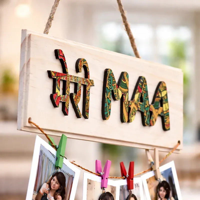 Decorative sign with colorful text and photo clips against a blurred background