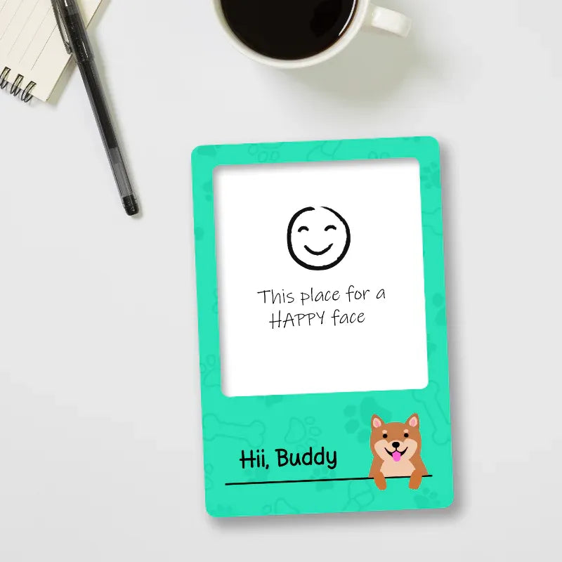 Digital mini photo fridge magnet with a green frame on a white surface, featuring text and a dog illustration.