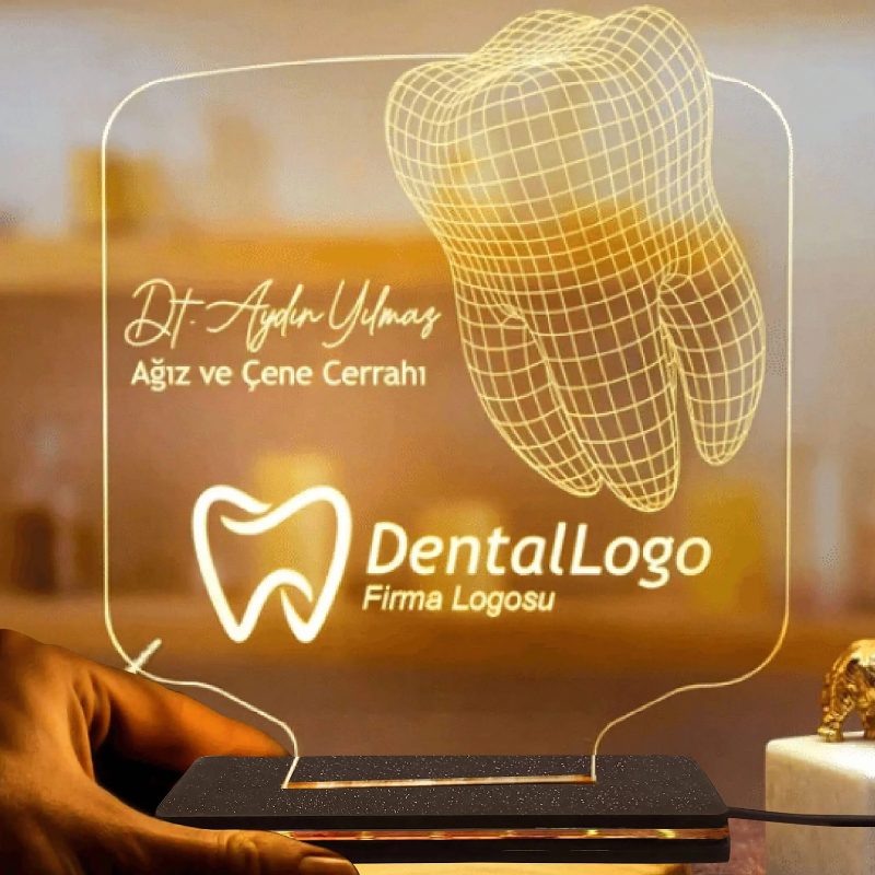 An LED name lamp illusion featuring a dental logo, with a 3D-like effect on a tabletop, accompanied by a person's hand and a marble-like surface below.