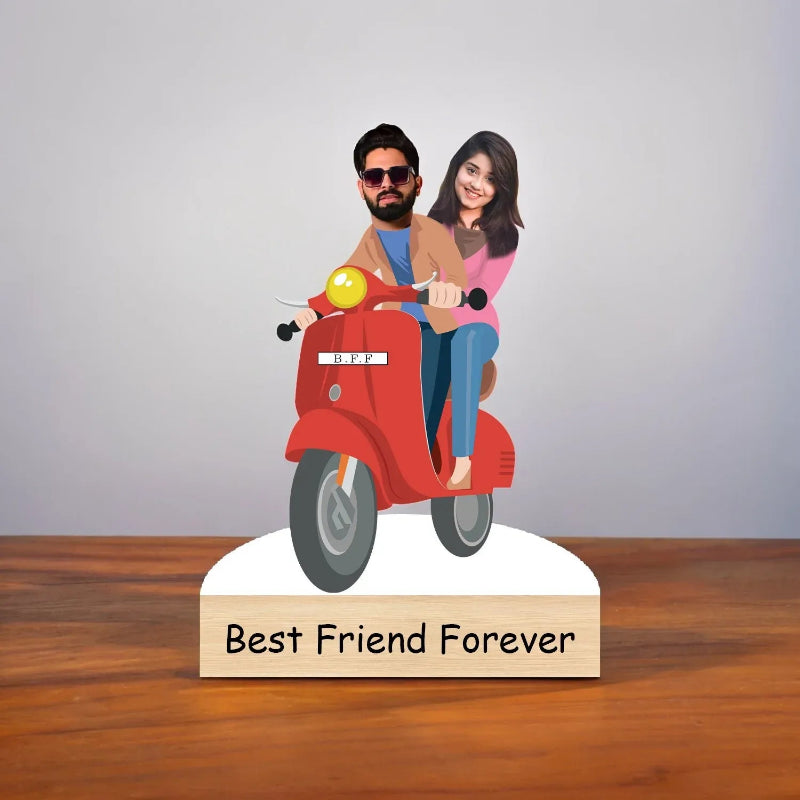 Figurine of a man and woman on a red scooter with 'Best Friend Forever' text below.