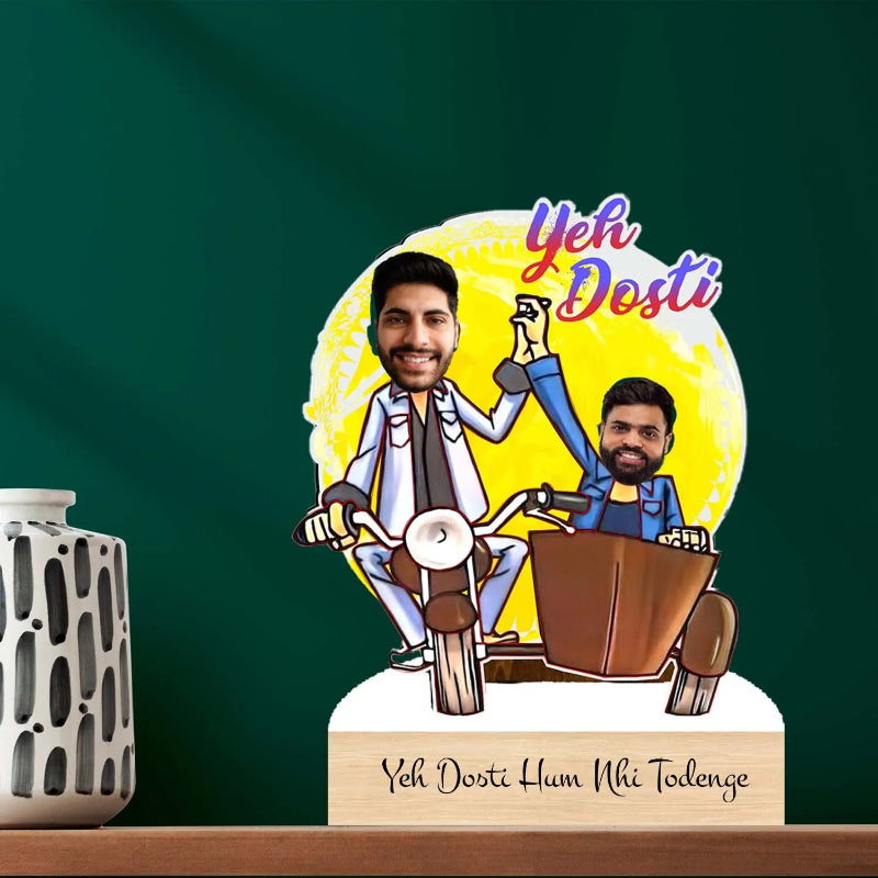 Decorative piece with two animated characters on a motorcycle and 'Yeh Dosti' text against a green background.