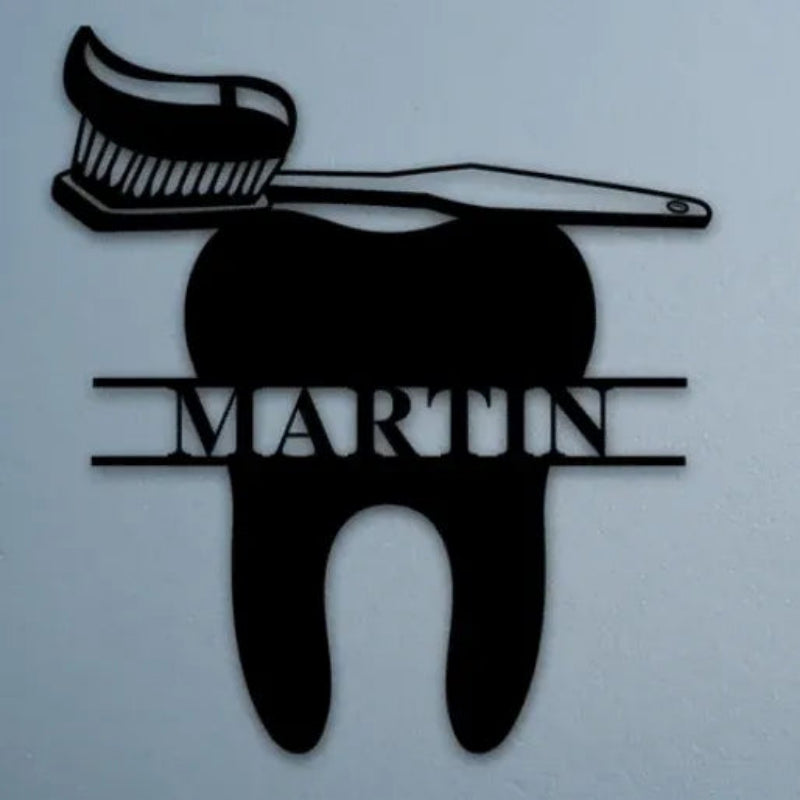 Decorative metal sign shaped like a tooth with a brush on top, branded 'Martin'.