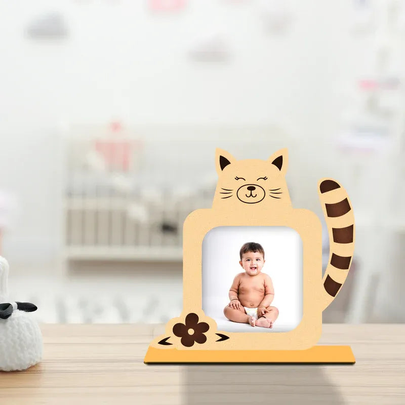 Personalised kids frame — wooden cat shaped baby photo frame with custom baby photo striped tail and flower design displayed in nursery setting, best baby birthday gift India from Zingy Gifts.