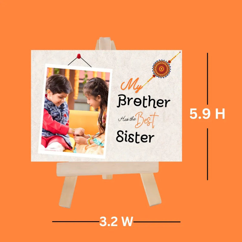 A personalized Ramiyan-style greeting card displayed on a small wooden easel against a solid orange background, with dimension labels showing 5.9 H height and 3.