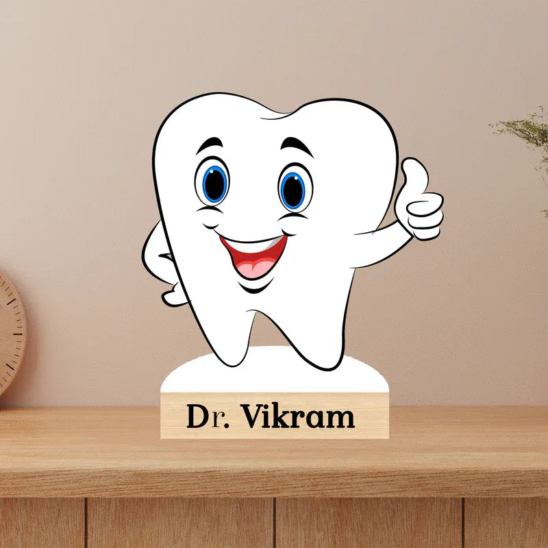 Cartoon tooth character with a 'Dr. Vikram' sign on a wooden surface.