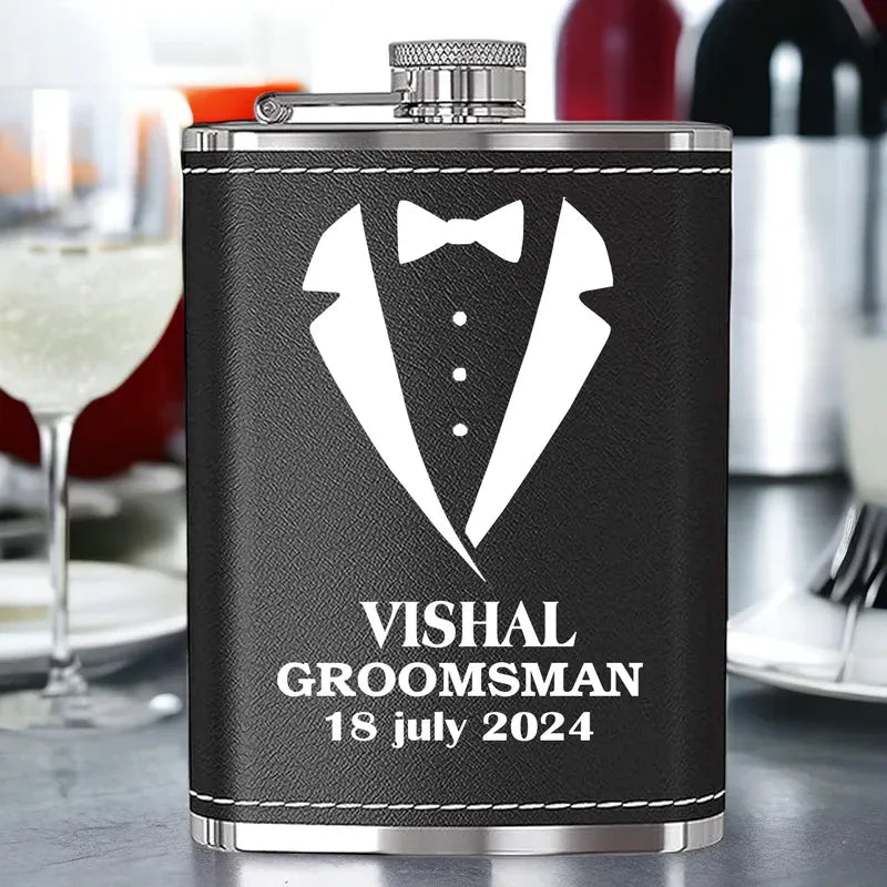 Black flask with white tuxedo design and text in a kitchen setting