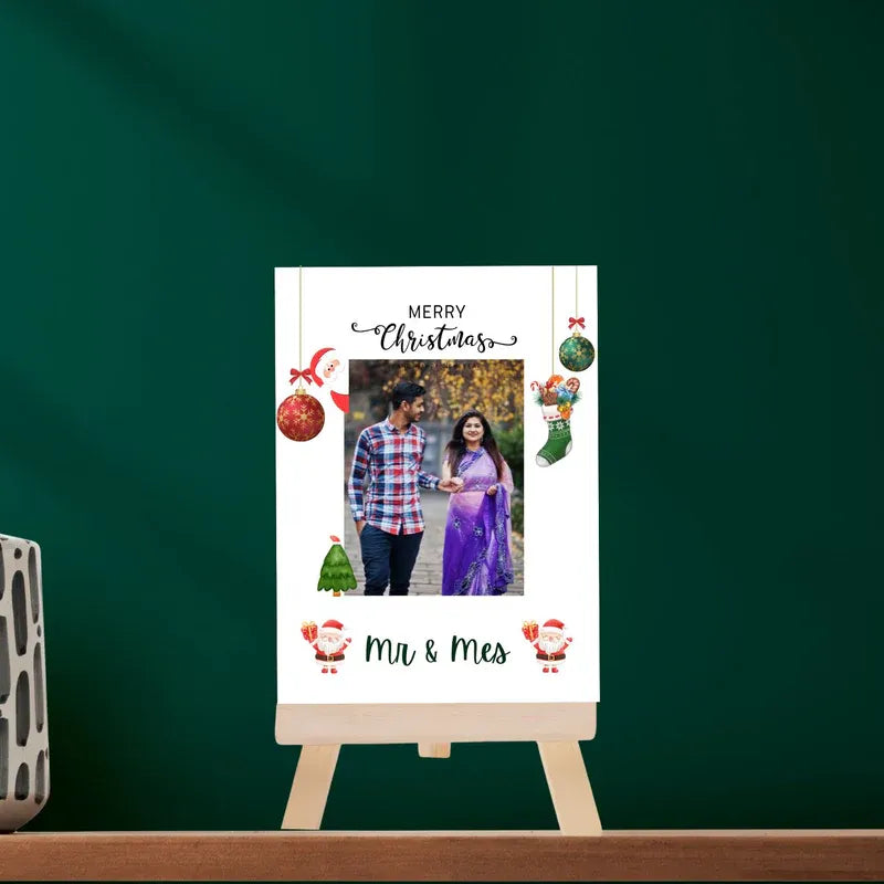 Personalized Christmas photo frame with a couple's photo on a green background