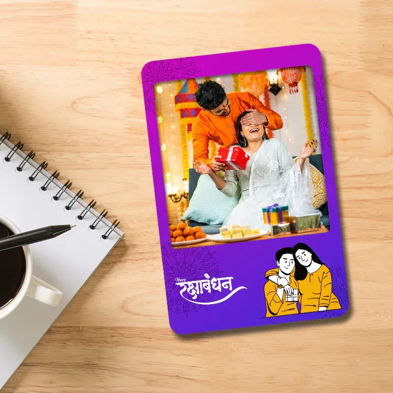 fridge magnet on a wooden surface next to a notebook and coffee cup.