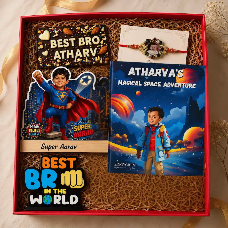 A personalized gift box set for brothers, containing a custom comic book, a 'Super Aarav' acrylic standee, a 'Best Bro Atharv' chocolate bar, a 'Atharva's Magical Space Adventure' book, and a red and white Rakhi, all arranged in a red box with brown crinkle paper.