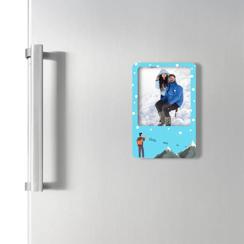 Framed photo of a couple on a refrigerator with a blue border