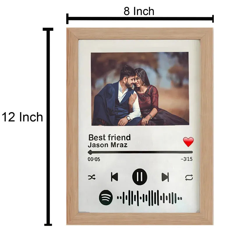 Wooden photo frame with a design of a couple and music player interface, showing dimensions.