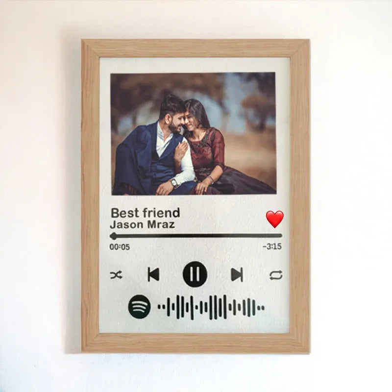 Framed artwork with a couple's photo and music player design, featuring 'Best friend' by Jason Mraz.