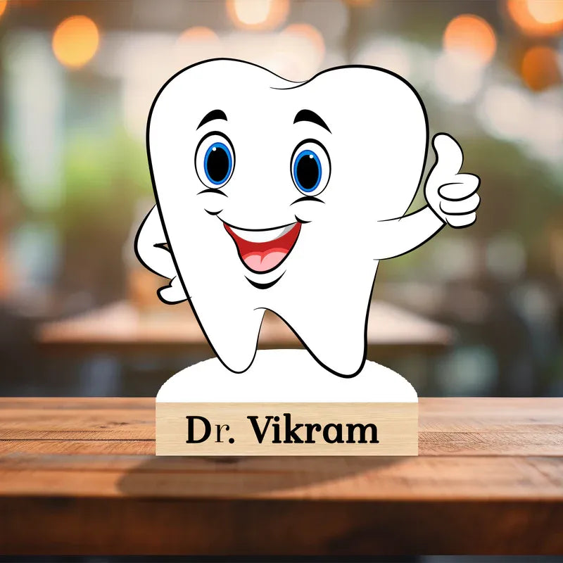 Cartoon tooth character with a 'Dr. Vikram' sign on a wooden surface