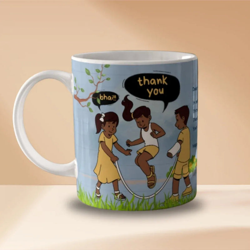 A white ceramic mug with a printed cartoon illustration of three children jumping rope outdoors. The design includes black speech bubbles with the words 'thank you' and 'bhau', a light blue sky background, green grass, and a tree branch.