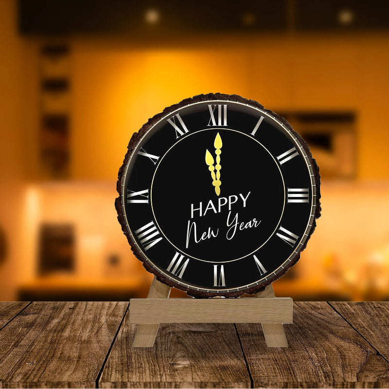 Decorative clock with 'Happy New Year' on a wooden stand against a blurred warm-toned background