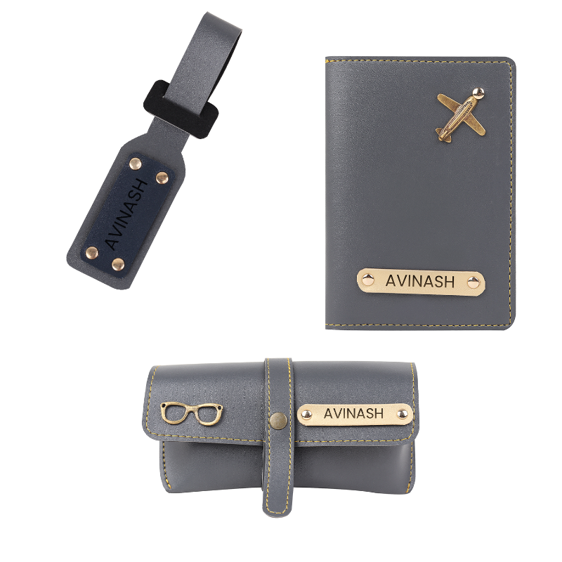Gray travel accessories set with 'Avinash' branding on a white background